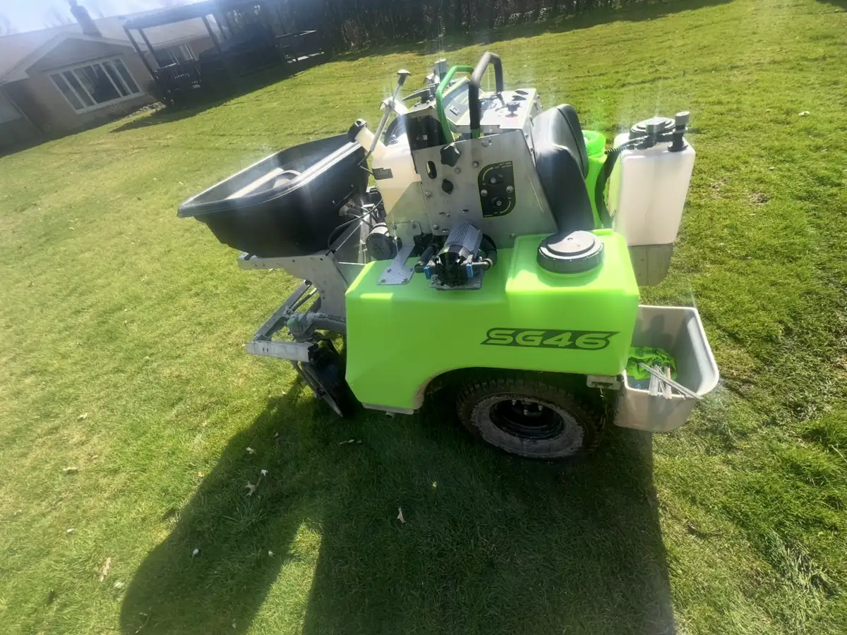Professional lawn care spreader used for fertilizer and weed control applications in Northeast Ohio