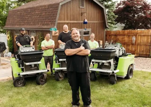 Field of Dreams Lawn Care team and professional treatment equipment